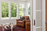 Living room with Marvin Signature Ultimate Casement windows and Signature Ultimate Sliding French Door