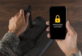 Man Holding A Phone With Lock Status Sensor Windows Locked Message Displayed 